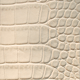 bone colored crocodile grain leather